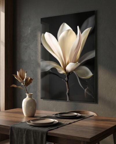 A cream-and-pink magnolia unfolds in soft low light, tender and fleeting against a hush of shadow.