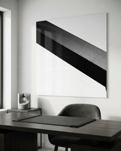 A board-marked concrete edge cuts a clean diagonal across luminous pale sky, mass meeting air in quiet geometric tension.