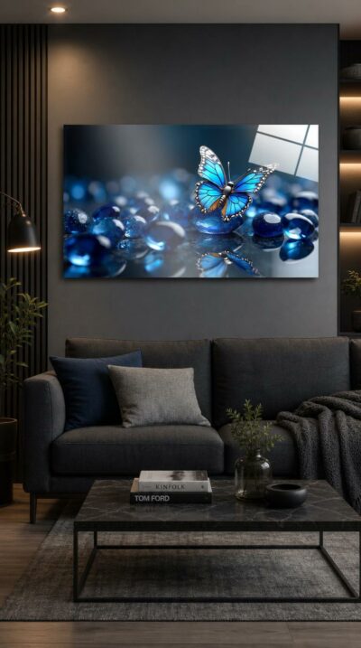 A luminous blue butterfly alights on polished sapphire stones, its wings glowing against a field of jewel-toned blue glass and quiet reflection.
