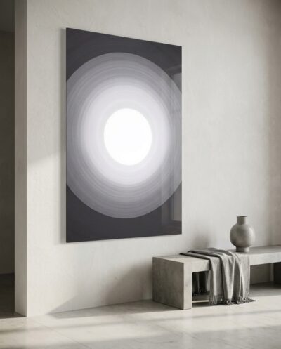 Concentric rings of soft grey deepen toward the edges, drawing the eye to a radiant white core like an opening onto the sky.