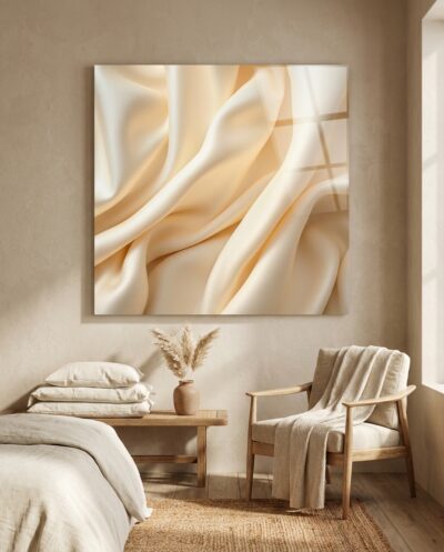 Folds of cream silk drift into soft ridges, their slubbed fibres catching a warm, low sheen that glows from within the cloth.