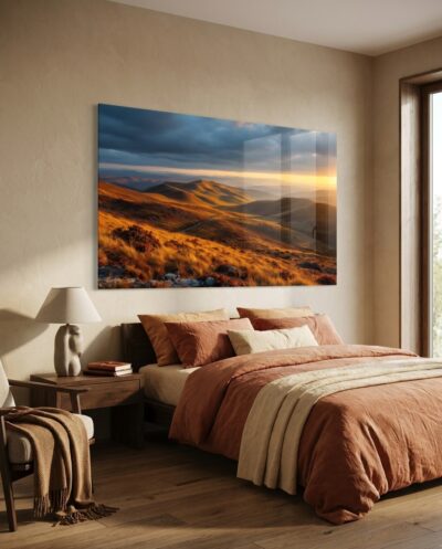 Rolling fells glow amber and gold as low raking light grazes the contours of an autumn wilderness.