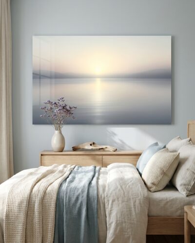 A mirror-still river mouth cradles the first pastel light of dawn beneath a soft veil of mist.