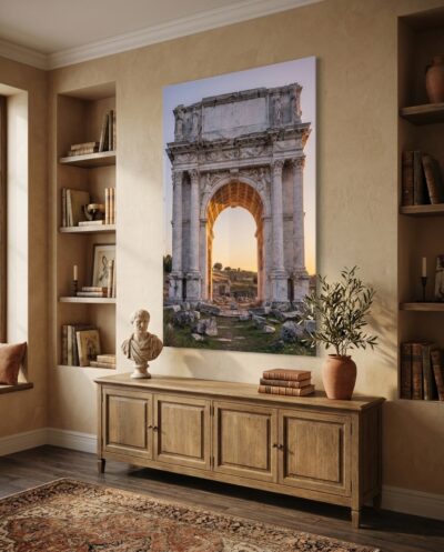 A Roman triumphal arch catches the last gold of evening, its coffered vault glowing while shadow gathers in the stone.