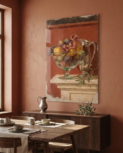 A glass bowl brimming with figs and split pomegranates rests beside a silver ewer, glowing against warm Pompeian red.