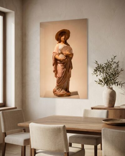 A young woman in a rose mantle and sun hat holds a small fan, a Hellenistic terracotta that found grace in an ordinary afternoon.