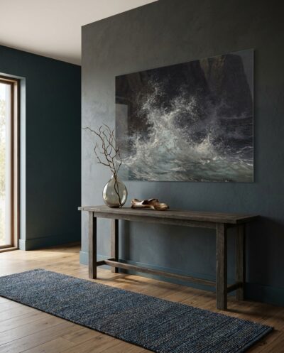 Backlit sea spray hangs glowing mid-air, suspended against a wall of near-black water and looming cliff.
