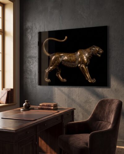 A cast bronze leopard strides through darkness, its incised spots catching warm light with quiet, kingly authority.