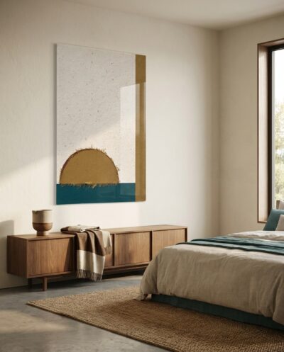 A caramel half-circle rises above a deep teal band on textured cream, steadied by a slim olive rule at the edge.