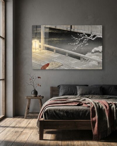 A snowbound veranda at night, where a paper lamp glows beside rolled bamboo blinds, an abandoned fan, and a plum branch bowed under fresh snow.