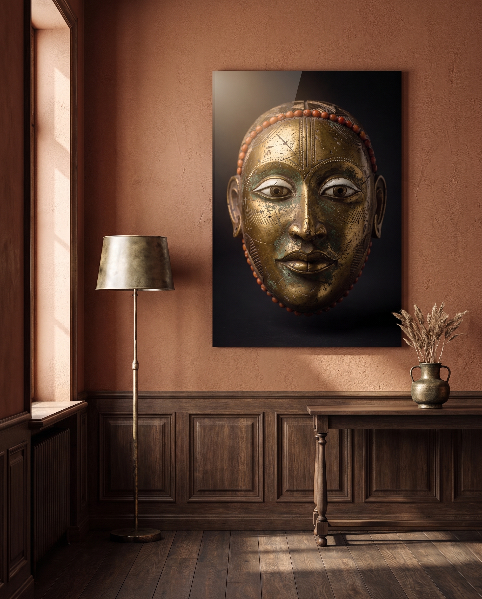 A serene golden mask, its coral-edged brow and almond eyes catching soft light against velvety darkness.