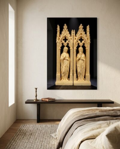 A carved ivory diptych of two robed figures rises through trefoil arches, glowing warm against deepest black.