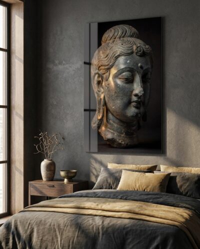 A grey schist Buddha head, eyes gently closed, drifting in the warm half-light of deep meditation.